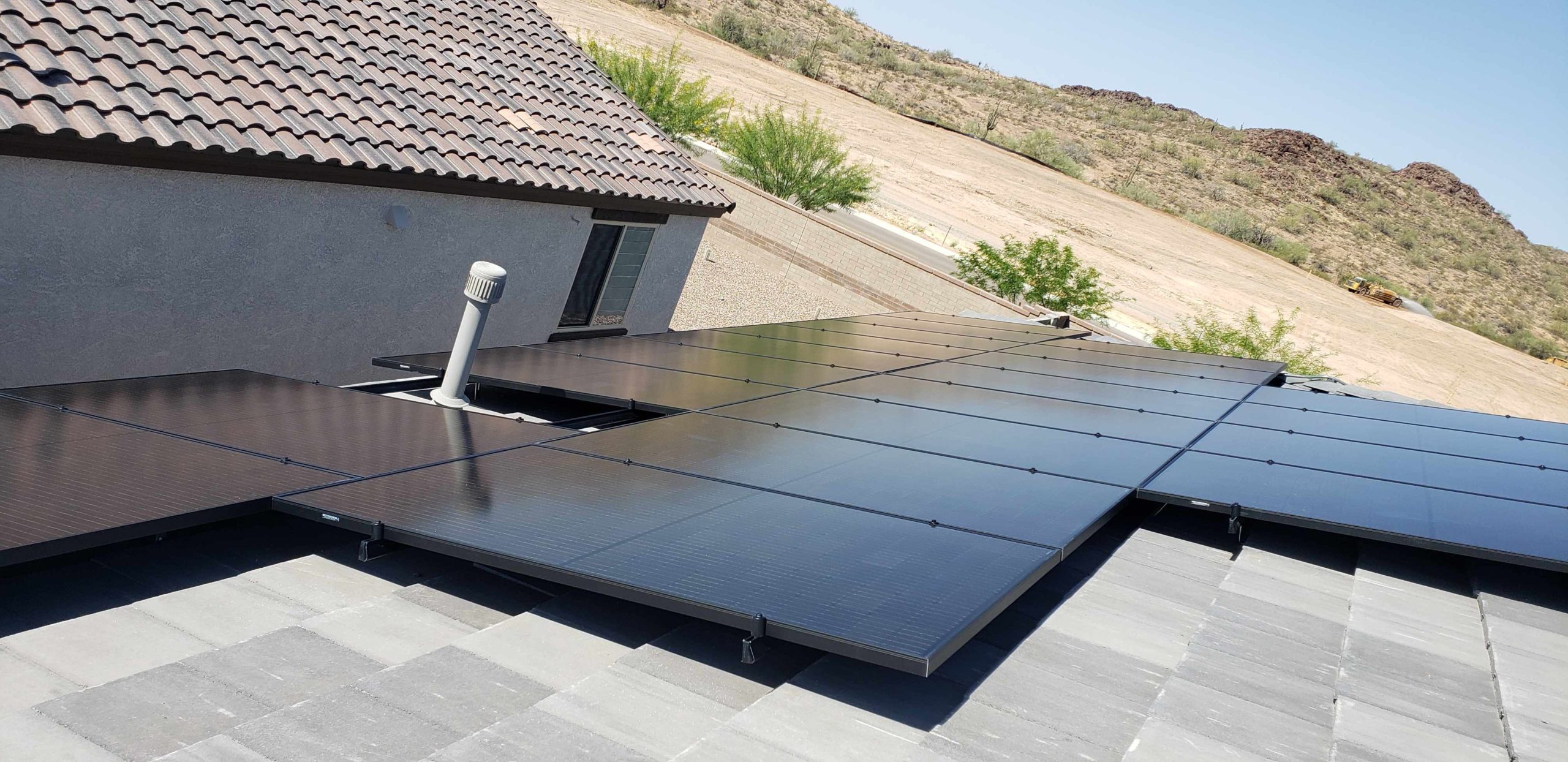 Rooftop Solar installation in Phoenix, Arizona with Desert in background.