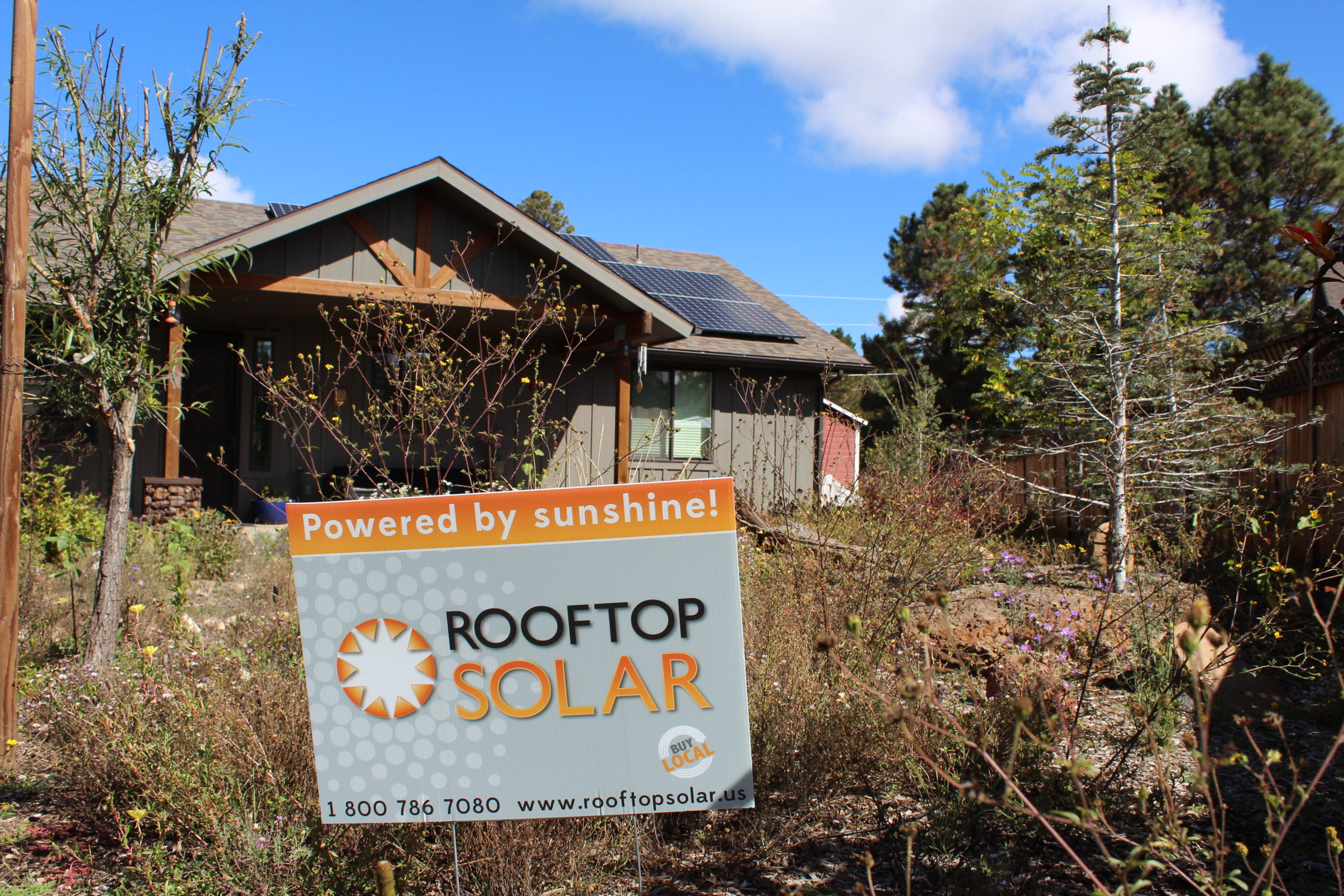 Rooftop Solar sign in front of Ziegler solar install.