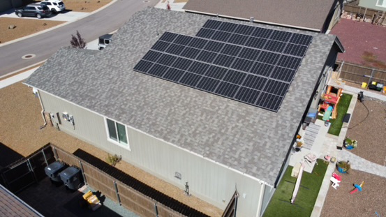 Aerial drone shot of Rooftop Solar system on the roof in Belllemont, AZ.