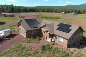 Arizona home with rooftop solar panels surrounded by high desert meadow
