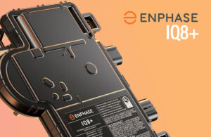 Close-up of an Enphase IQ8 microinverter installed on a solar panel system.
