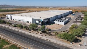 Large data center facility in the Phoenix, Arizona desert illustrating growing energy demand, grid infrastructure expansion, and the future of electricity consumption in Arizona.